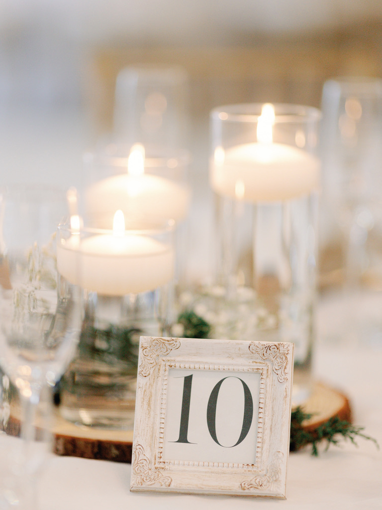 floating candles on a wedding reception table on Delightful Planning Blog FL