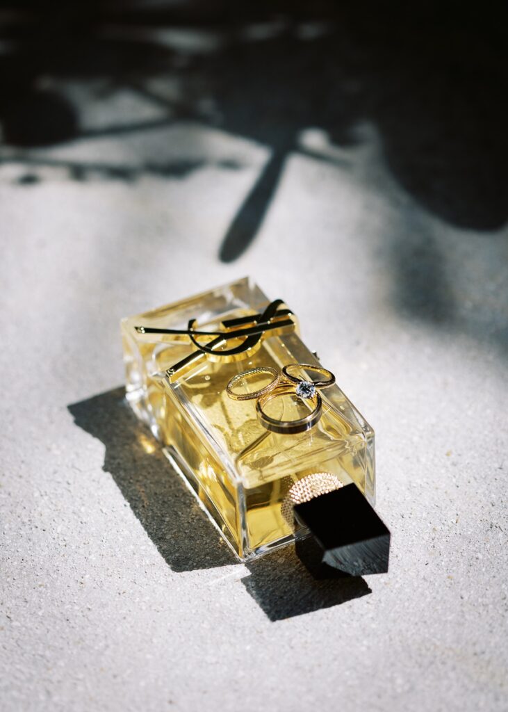 Moody image of a cologne bottle gifted to the groom
