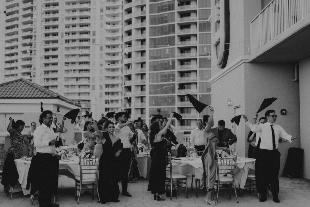 Wedding guests at outdoor wedding reception venue space.